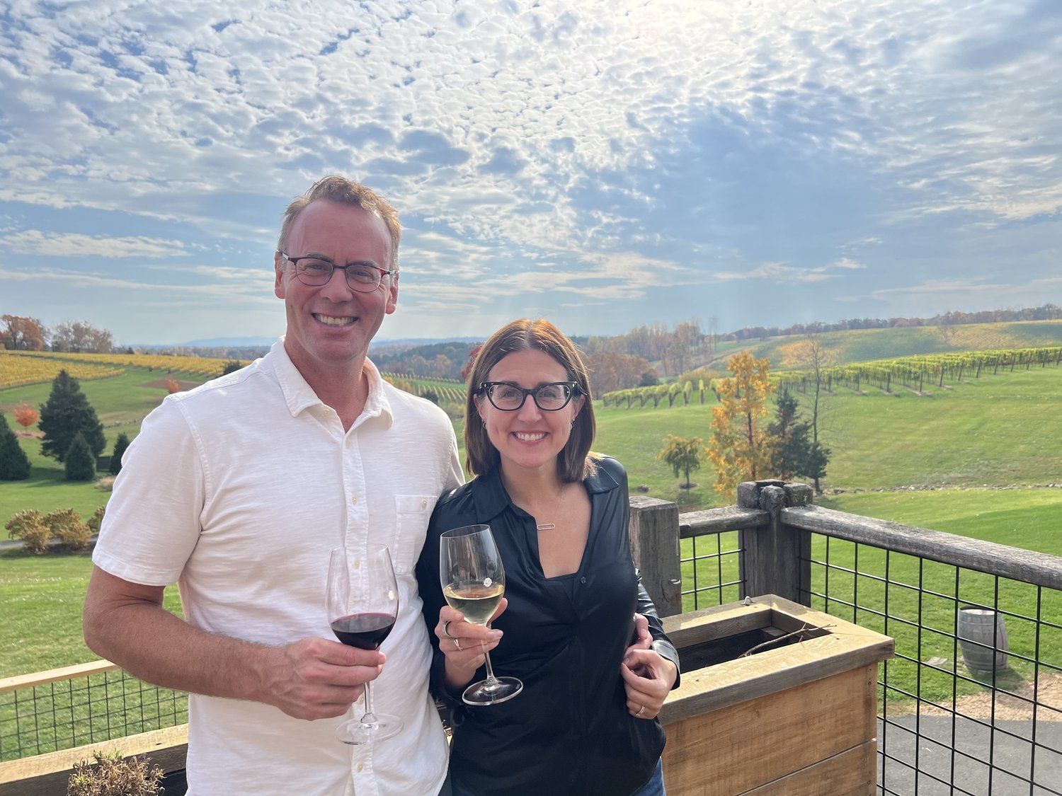 Stan and Allison enjoying a glass of wine beside a Virginia vineyard